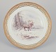 Royal 
Copenhagen 
Fauna Danica, 
dinner plate 
featuring a 
motif of 
reindeer. Gold 
...