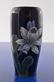 Royal 
Copenhagen 
porcelain, vase 
with flowers 
motif Magnolia. 
 
Vase no. 
2797/235 Height 
17 cm. ...