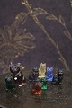 Small, old dog and cat figurines in stained glass...