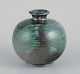 Upsala Ekeby, 
Sweden.
Ceramic vase 
with glaze in 
green and black 
stripes.
From around 
...