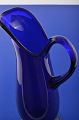 Holmegaard 
/Kastrup 
glasworks. Old 
beautiful blue 
glass pitcher, 
height at 
handles 34.3 
cm. ...