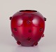 Monica Bratt. 
Art glass vase 
in dark red 
glass.
Model: 
”Hjortron” 
(Cloudberry). 
Handmade.
From ...