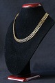 Beautiful gold necklace in 14 carat gold with classic beautiful V pattern in two rows. The ...