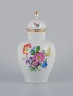 Meissen, low vase in porcelain. Polychrome flower motifs in overglaze.