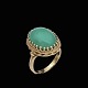 14k Gold Ring 
with 
Chrysoprase.
Stamped with 
14k
Size 52 mm - 
US 6.
1,9 x 1,5 cm. 
/ 0,75 x ...