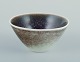 Rörstrand, 
Sweden. Small 
ceramic bowl.
Hand-glazed. 
Glaze in 
violet, green, 
and 
sand-colored 
...