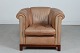 Chesterfield 
Chair from the 
1980s
With light 
brown leather, 
frame and legs 
of ...