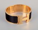 Hermes, France.
Clic Clac H 
bracelet. 
Gold-plated 
metal and 
enamel.
Original box 
and dust bag, 
...