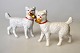 Two porcelain 
dogs, 19th 
century 
Germany. Each 
holds his own 
shoe. Gilding 
on shoes and 
painted. ...