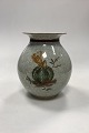 Royal 
Copenhagen 
Cracked Vase 
No.443/2505 in 
gray with gold 
and green 
decoration. 1st 
Quality in ...