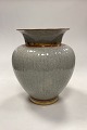 Royal 
Copenhagen 
Cracked Vase 
No. 259/2793 in 
gray with gold 
and siena red 
decoration. 1st 
...