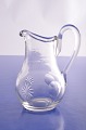 Small clear 
glass cream jug 
with cut stars, 
height 10.8 cm. 
 
Fne condition.
