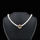 Ole Lynggaard. 
Pearl Necklace 
with 14k Gold 
Clasp with 
Diamond and 
Sapphire.
Freshwater ...