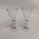 Par 
portvinsglas 
snerleglas fra 
Holmegaard 
Glasværk fra 
omkring 1900. 
Hhv. 10,5 og 
10.8 cm. ...