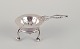 Georg Jensen, 
early tea 
strainer with 
holder. 830 
silver.