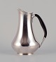 Cohr, Denmark. 
Pitcher in 830 
silver. Handle 
made of 
precious wood.
Classic shape. 
Art ...
