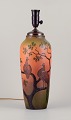 Ipsens, 
Denmark. Large 
table lamp in 
ceramic.
Motif of 
peacocks 
sitting in a 
tree.
Orange and ...