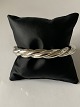 Elegant 
bracelet in 
silver
Stamped 900
Internal 
dimensions 
approx. 66.63 
mm
Thickness 
approx. ...
