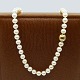 Ole Lynggaard; 
"Smilet" 
jewellery clasp 
of 14k gold and 
white gold.
Sold with a 
pearl necklace 
...