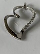 Heart pendant 
in Silver with 
stones
Stamped 925S 
JAa
Length with 
eaves. 5.8 cm
Width. 3.8 ...