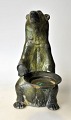 Standing green 
patinated polar 
bear, 20th 
century 
Denmark. 
Standing with a 
tray. Silver 
pewter. ...
