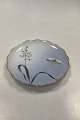 Bing & Grondahl 
Cake Plate with 
Flower 
decoration and 
goldrim. 17 cm 
diameter.
Sanded down on 
...