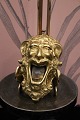 Decorative, 
funny old 
ashtray in 
brass in the 
shape of the 
face of a 
mythical 
creature, a 
sphinx ...