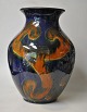 Danish ceramist 
(20th century): 
Large floor 
vase. Glazed 
clay. Glazes in 
yellow, red, 
blue and ...