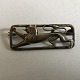 Brooch with 
lion, approx. 4 
x 1.5 cm, 
stamped, nice 
used condition.