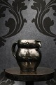 "Lillerød" owl jug in glazed earthenware in fine dark green glaze...