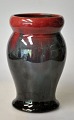 Michael 
Andersen & Son, 
vase, 20th 
century 
Denmark. Glaze 
in red, green 
and black. 
Without ...