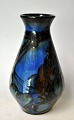 Danico vase, 
20th century 
Denmark. Reds 
with blue, 
rowan and brown 
overglazes. 
Stamped. H.: 
16.5 ...