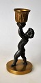 Small 
candlestick of 
a boy, 20th 
century. 
Bronze/patinated 
metal. 
Unsigned. 
Height: 13 cm.