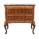 Walnut veneered 
and partly gilt 
commode with a 
marble top
Altona, 
Northgermany, 
circa ...