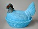 Glass hen, 
light blue 
glass, 19th 
century. 
Painted head. 
L.: 16 cm. H.: 
11.5 cm.