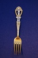 Michelsen 
Christmas 
spoons and 
forks of Danish 
gilt sterling 
silver or three 
Towers silver. 
...