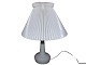 Le Klint 311 
table lamp, 
white art 
glass.
Height 49 cm., 
including 
shade.
Both the shade 
...