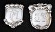 A pair of coat 
tags in silver, 
20th century 
Denmark. H: 5.3 
- 6 cm. W: 3 - 
5 cm. Stamped.