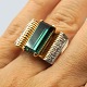 Gold ring set with a turmaline and diamonds