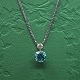 A necklace in 
14k white gold 
set with a 
turquoise 
zircon and a 
diamond, 0,20 
ct. Top 
Wesselton - ...