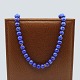 Long necklace 
of lapis lazuli 
pearls, with 
clasp in 14k 
gold.
L. 64 cm.
Stamped "14k 
...