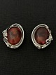 Silver ear clip 
with inlaid 
amber
Stamped WK 925
Height 2.5 cm
Width 2.0 cm
See also our 
...