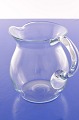 Holmegaard 
glasswork. 
Glass jug with 
handle, height 
14 cm. Capacity 
850 cl. Fine 
condition.