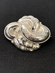 This silver 
brooch has a 
beautiful and 
detailed 
pattern that 
gives the 
brooch life. 
The twisted ...