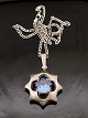 Sterling silver 
star pendant D. 
3.5 cm with 
aquamarine and 
sterling silver 
chain 44 cm. 
from ...