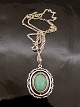 Sterling silver 
pendant 2.7 x 
3.5 cm. with 
turquoise and 
sterling silver 
chain 48v cm. 
Item No. ...