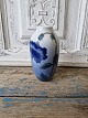 Royal 
Copenhagen 
small vase 
decorated with 
blue flower 
No. 1910/239, 
Factory first
Height 14 cm.