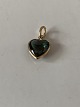 Nice and 
discreet 
pendant, shaped 
like a heart 
with a green 
stone in 14 
carat gold. 
Suitable for 
...
