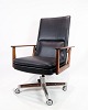 Office chair, 
Model 419 with 
rosewood frame, 
seat and back 
upholstered in 
black leather. 
As well ...