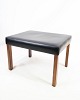 Stool of 
upholstered 
black leather 
with rosewood 
legs of Danish 
design produced 
in the 1960s. 
...